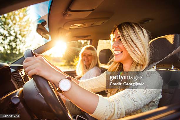 going on a family vacation - girls driving a car stock pictures, royalty-free photos & images