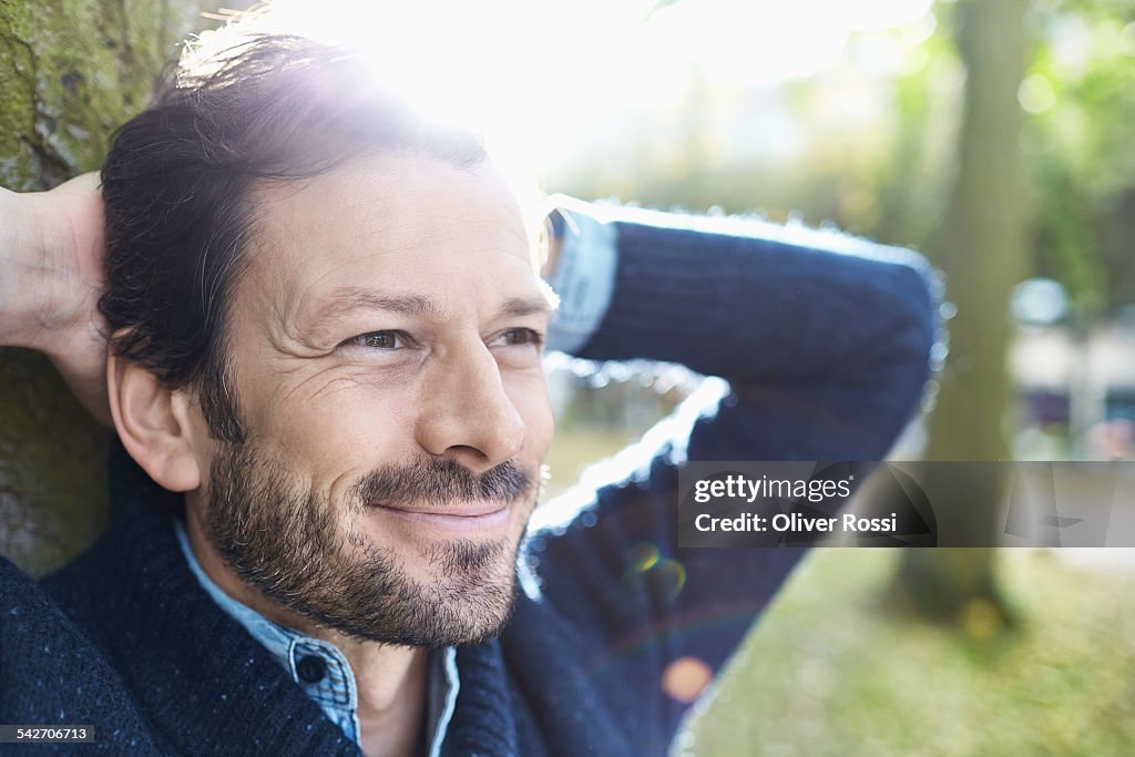 Smiling man in park