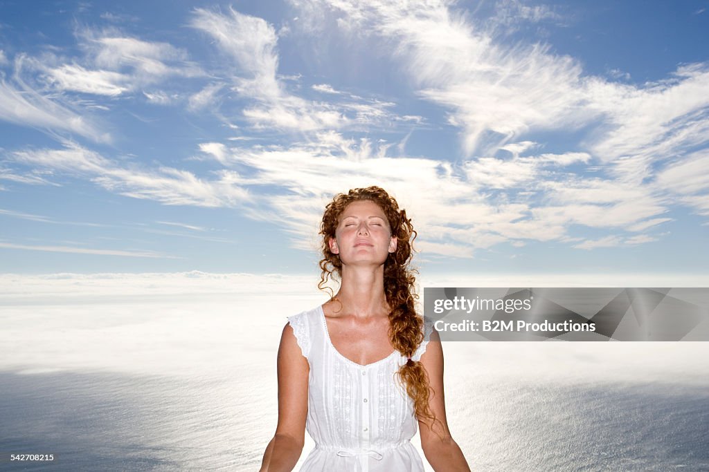 Woman doing yoga in montains