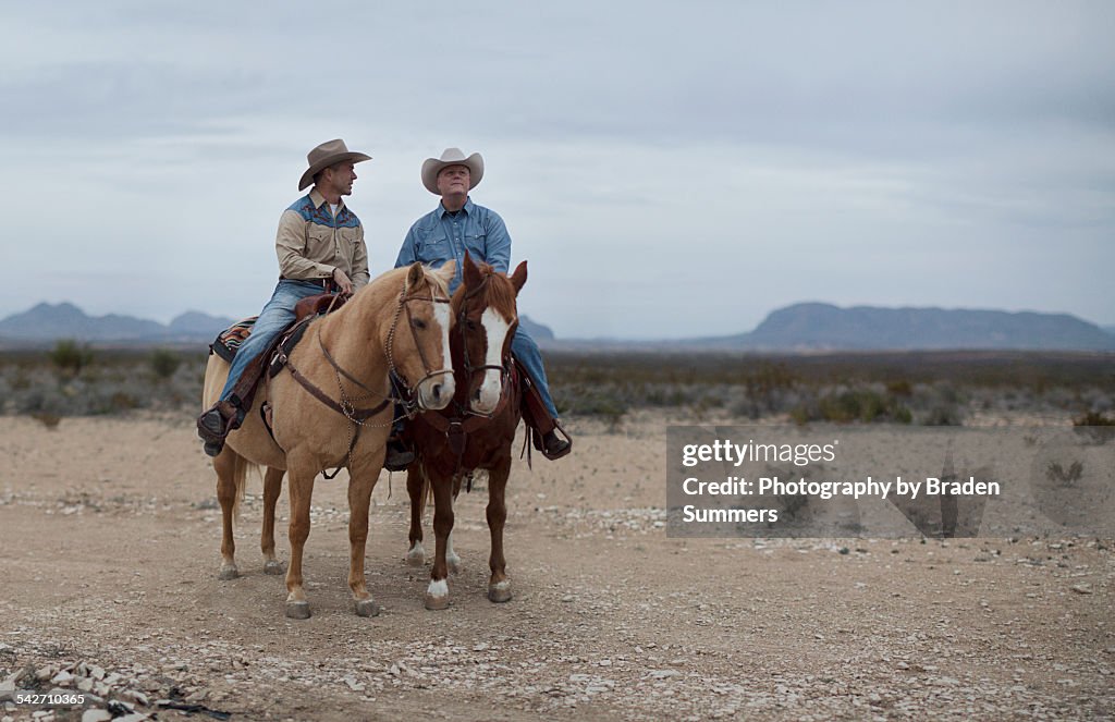 Gay couple in Texas on horses.