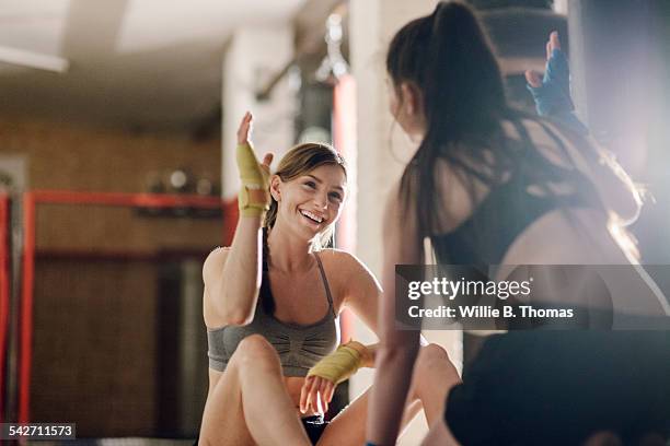 female fighter successfully completing training - fitness or vitality or sport and women fotografías e imágenes de stock