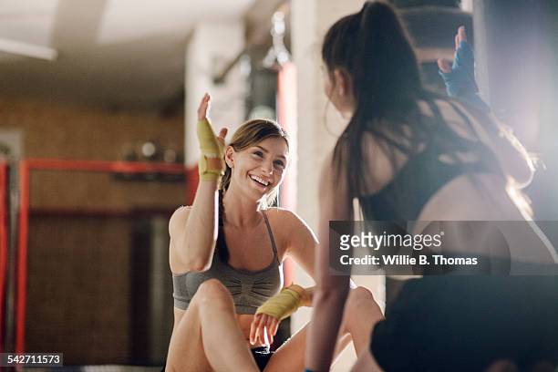 female fighter successfully completing training - sport foto e immagini stock