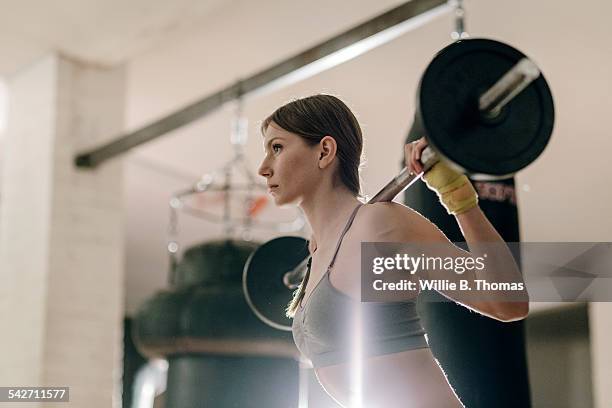 female weight lifting with barbell - german bodybuilder stock pictures, royalty-free photos & images