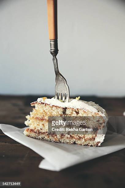 vintage fork in a layered cake - rekha garton stock-fotos und bilder
