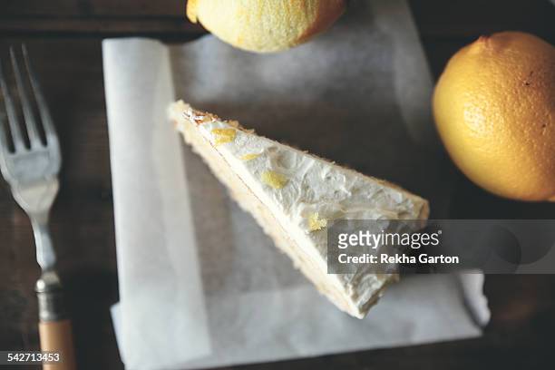 slice of lemon cake with lemons - rekha garton stock pictures, royalty-free photos & images