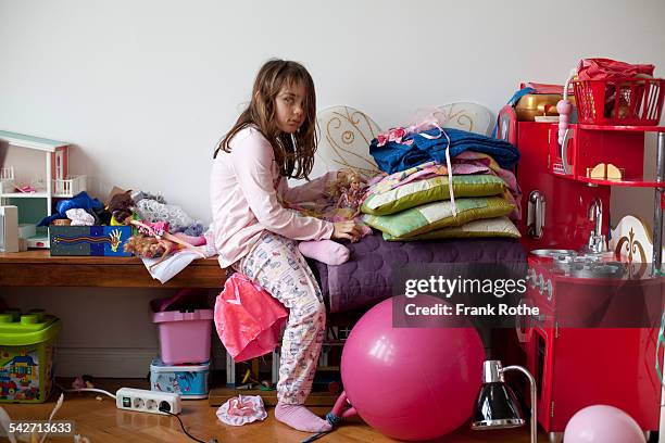 portrait of a young kind in the playroom - messy playroom stock-fotos und bilder