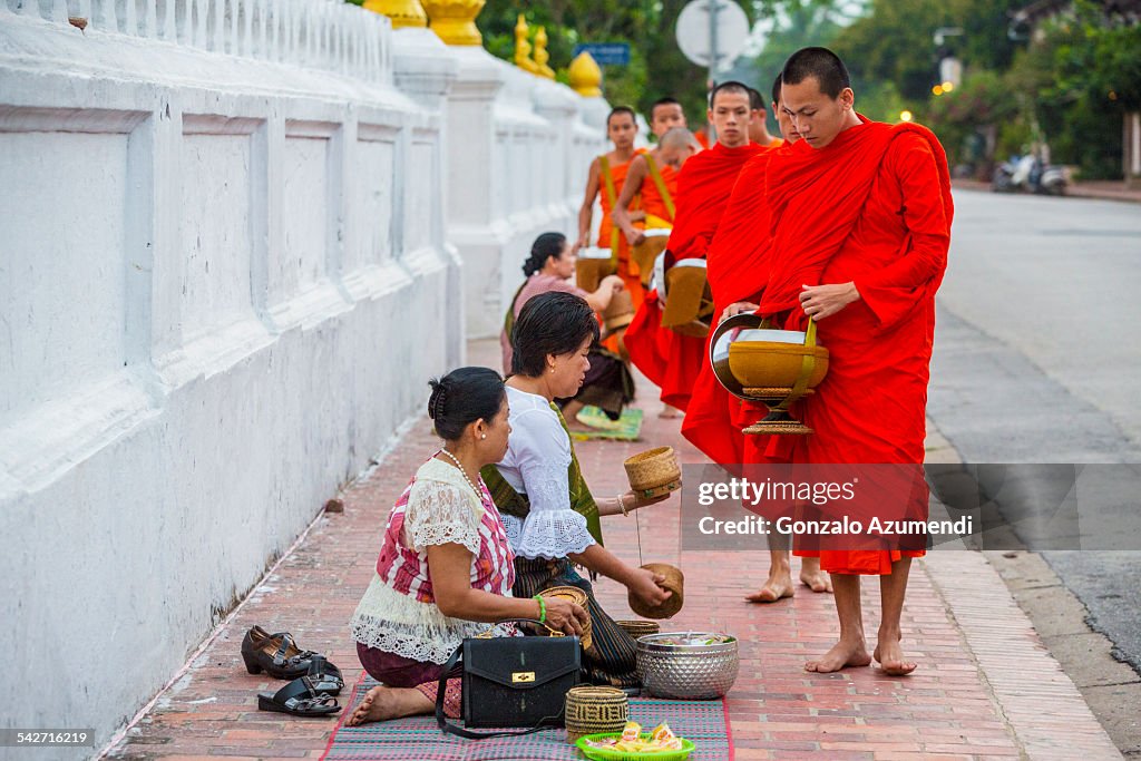 Monks collecting alms in Luang Prabang.