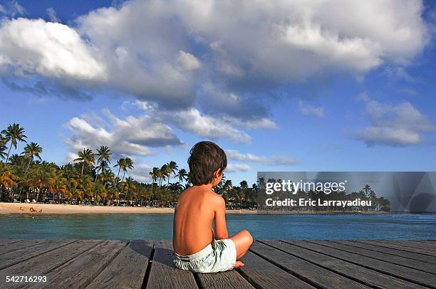 young boy on a pontoon - guadeloupe photos et images de collection