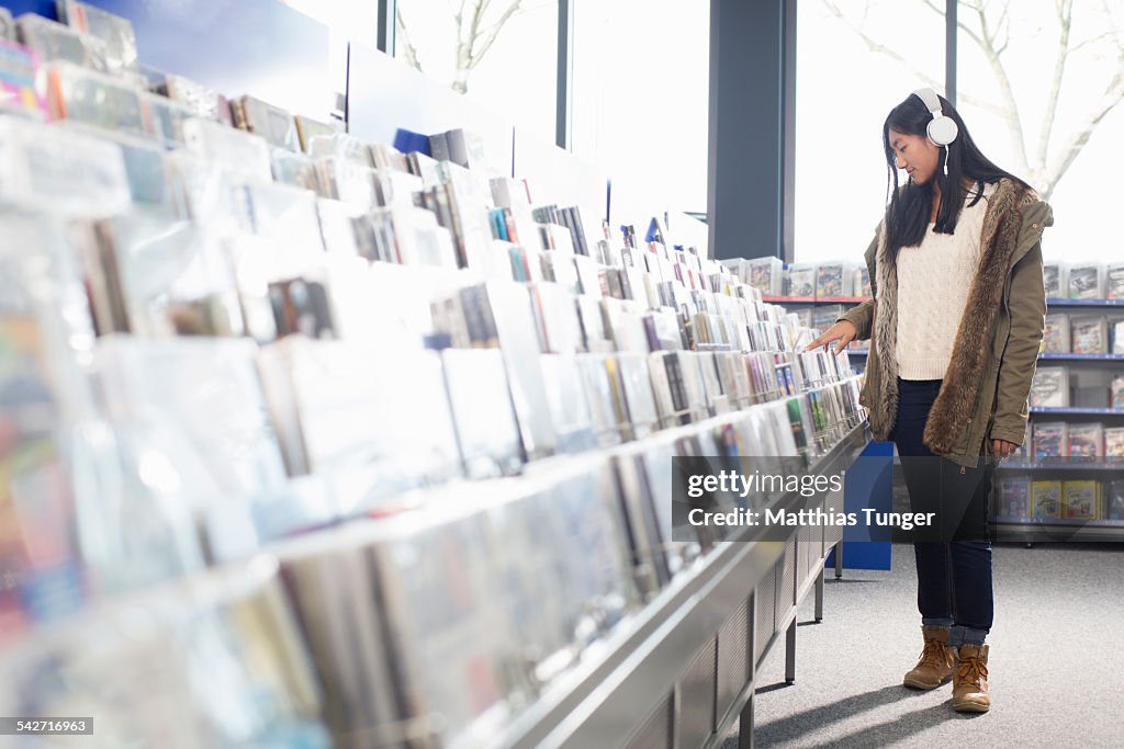 Young girl looking for some new music CD's