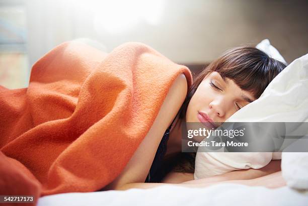 young woman sleeping - woman sleep bedroom foto e immagini stock