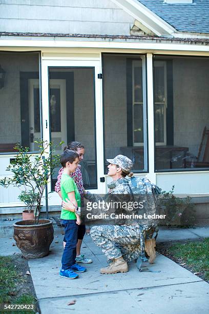 Military Mom Kneeling and Talking with her kids