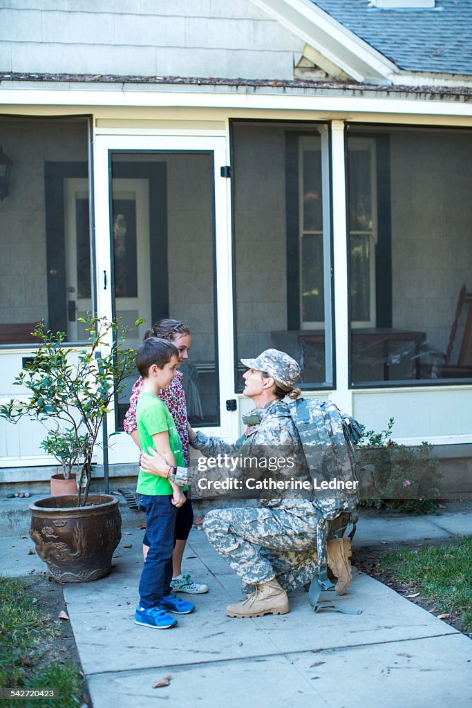 Military Mom Kneeling and Talking with her kids