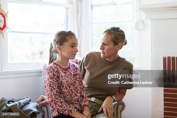 military mom at home having a serious conversation - foundation conversations story of a girl stockfoto's en -beelden