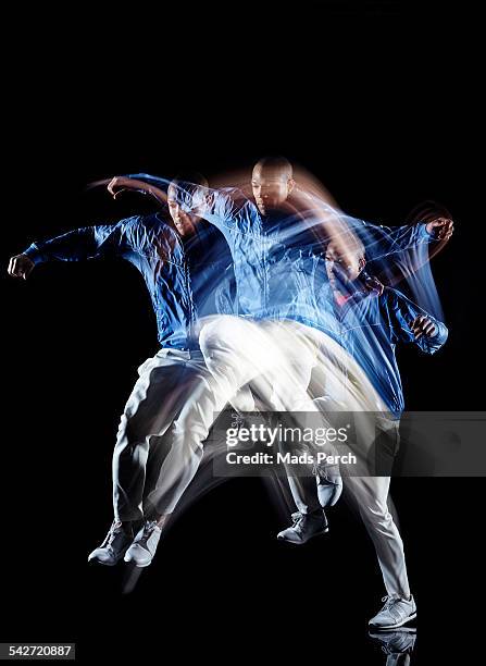 man jumping - multiple exposure movement stock pictures, royalty-free photos & images