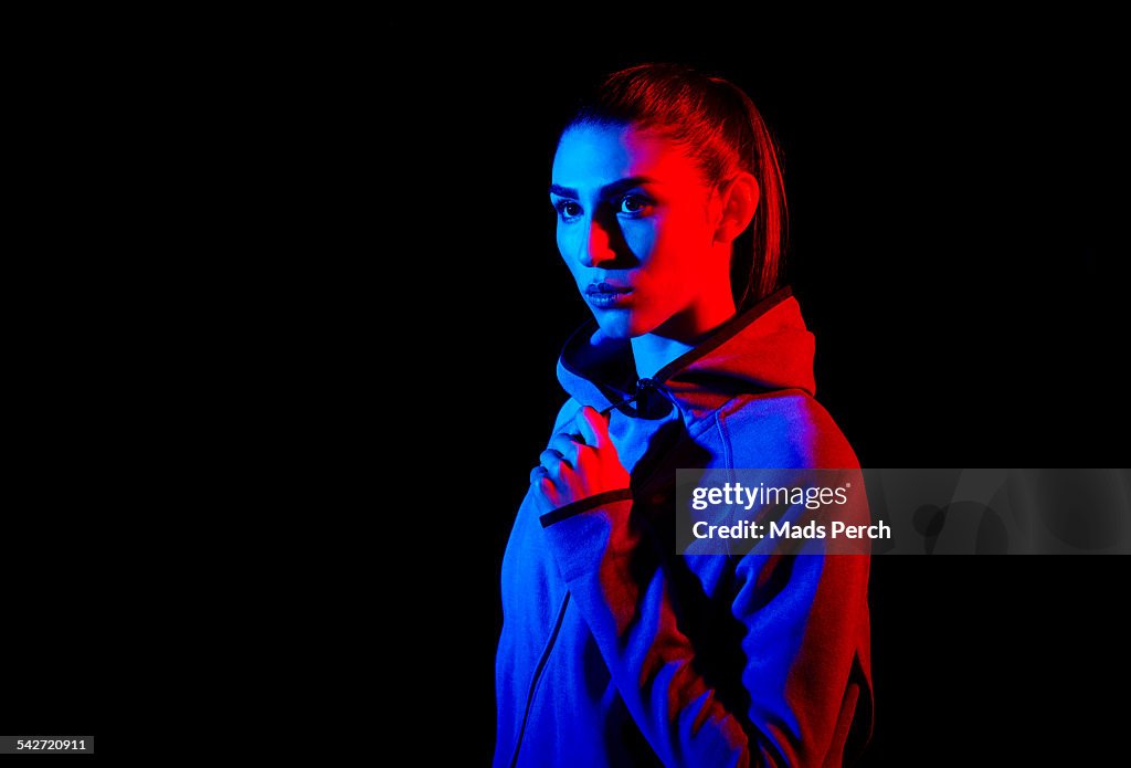 Young woman photographed with creative lighting