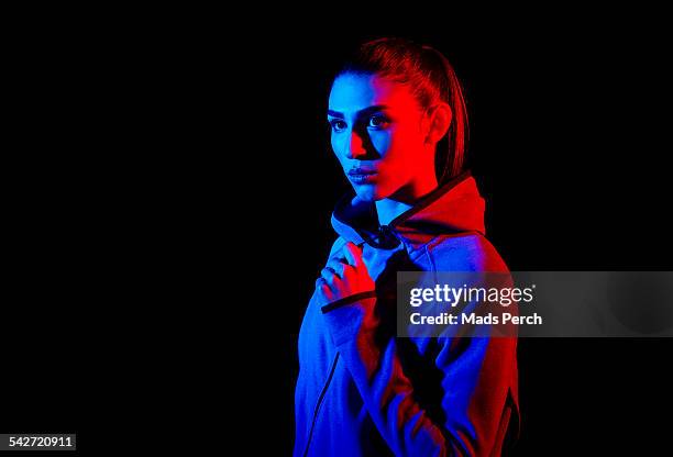 young woman photographed with creative lighting - stämningsfull bildbanksfoton och bilder