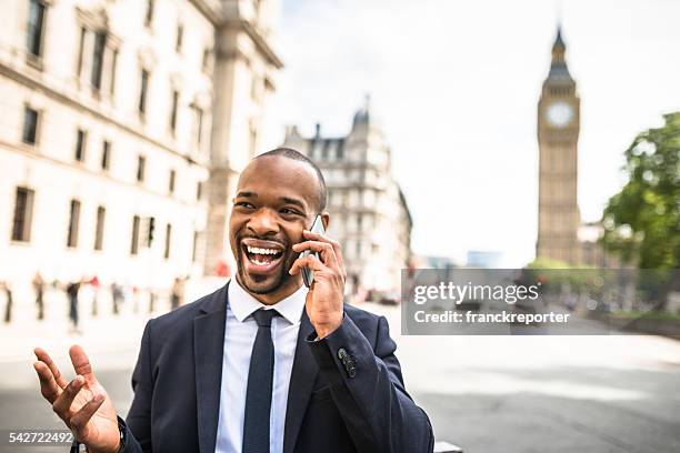 businessman on the phone in london - black politician stock pictures, royalty-free photos & images