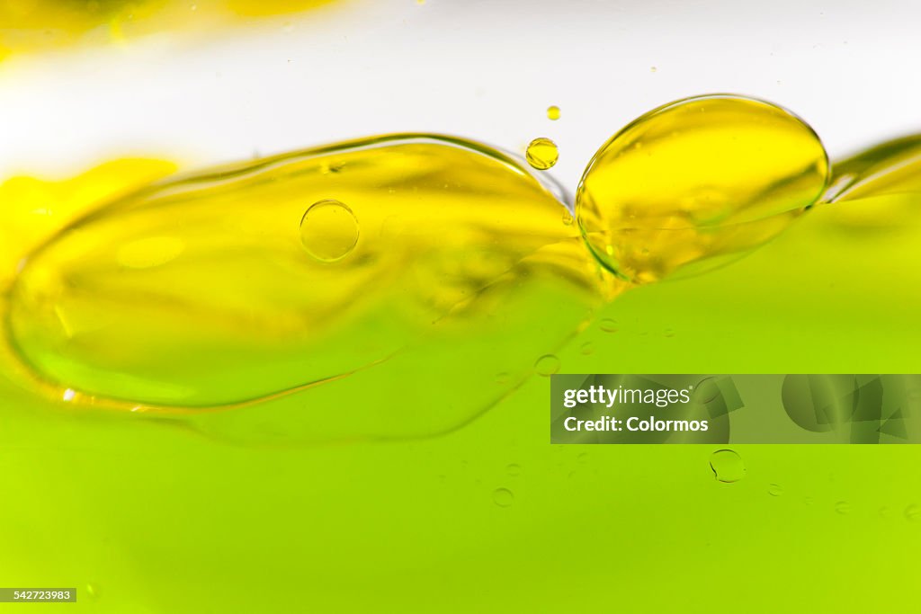 Colored liquids with bubbles, close-up