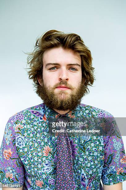Portrait of man is colorful shirt and matching tie