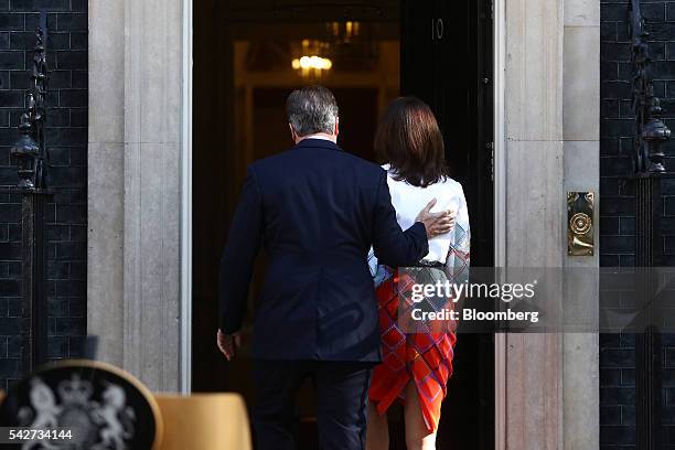 David Cameron, U.K. Prime minister and leader of the Conservative Party, left, heads back into 10 Downing Street, with his wife Samantha Cameron,...