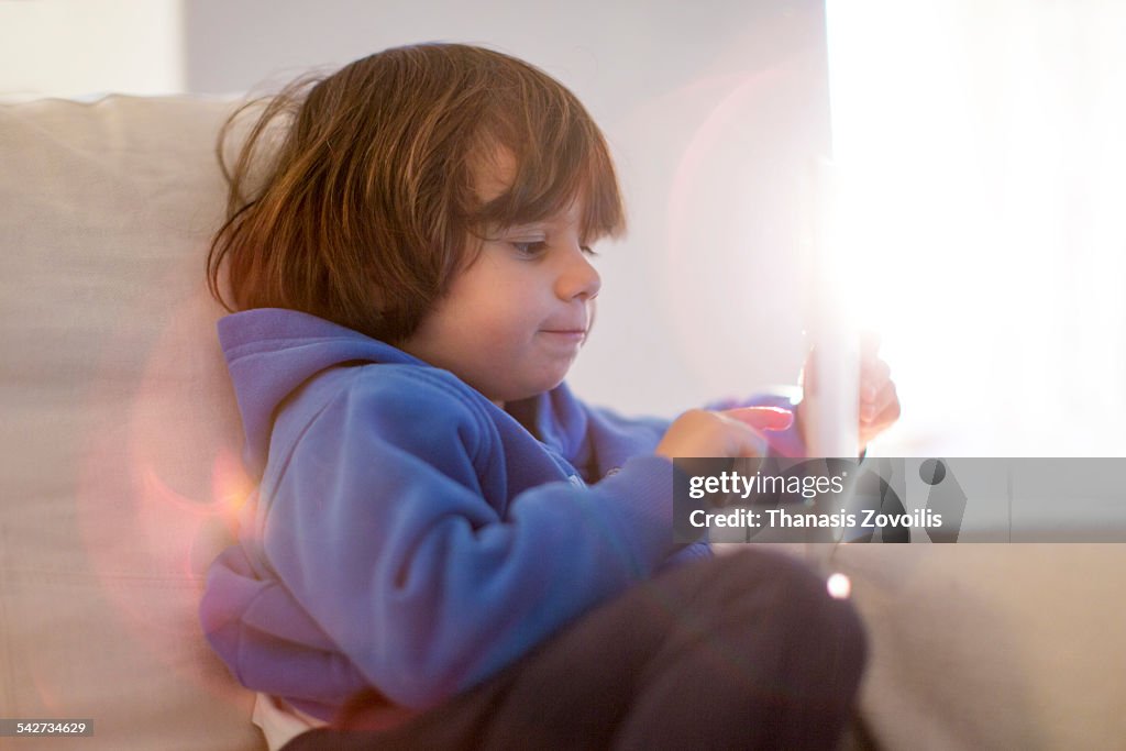 Small boy using a digital tablet