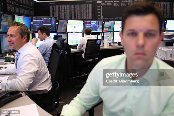 Financial traders monitor data following the U.K's European Union referendum vote results inside Frankfurt Stock Exchange in Frankfurt, Germany, on...