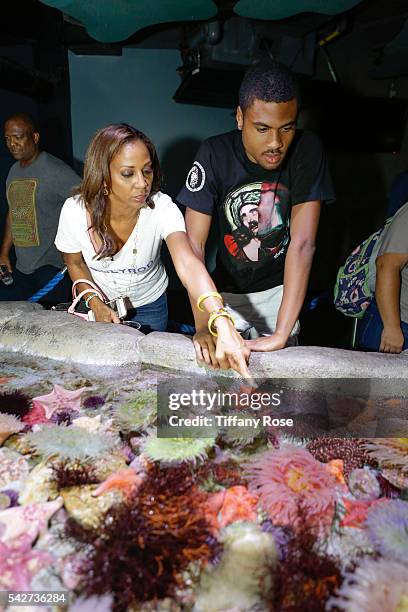 Actress Holly Robinson Peete and son Rodney Peete Jr. Attend the HollyRod Foundation's "My Brother Charlie goes to the Aquarium" Presented by...