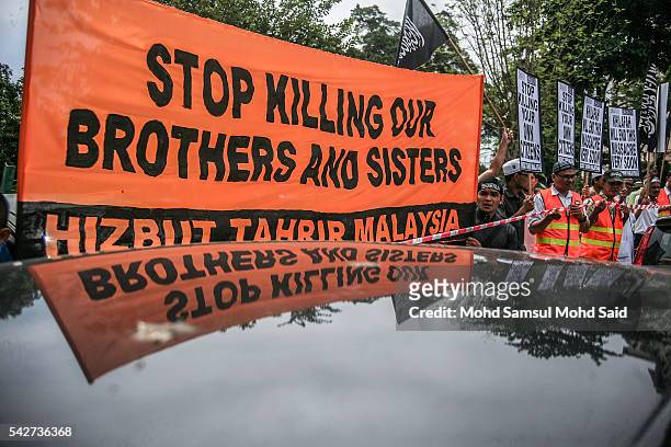 Malaysian Islamic NGO hold a banner message in front of Syria embassy during a protest against Syria and Rusia goverment warplanes on June 24, 2016...