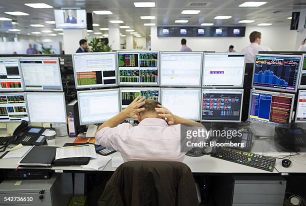 Financial traders react to the European Union referendum vote at ETX Capital in London, U.K., on Friday, June 24, 2016. Global markets buckled as...