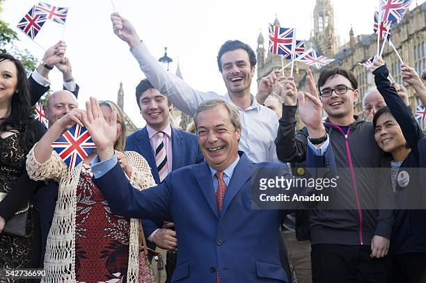 Party leader Nigel Farage greets supporters before a press conference in Westminster after British people voted in the British EU Referendum to leave...