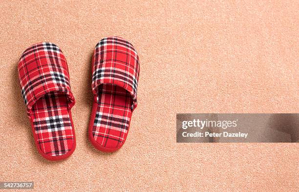 tartan slippers with copy space - pantoffel stockfoto's en -beelden