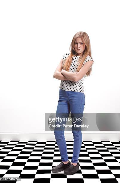 teenager with attitude - girl standing crossed arms studio stock pictures, royalty-free photos & images