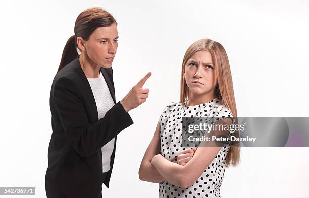 rebellious teenager with mother - strict parent fotografías e imágenes de stock