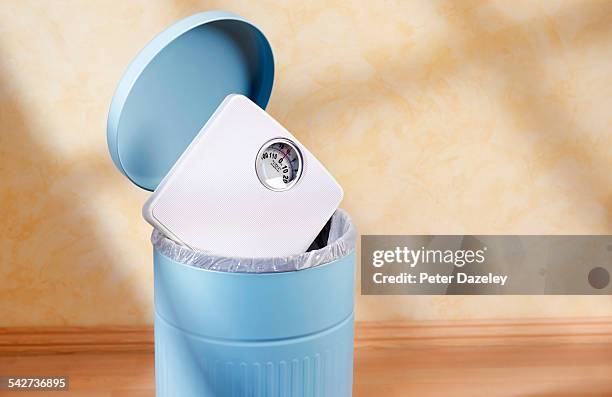 bathroom scales in bin - body conscious stock pictures, royalty-free photos & images
