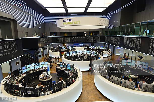 Trader sit at their desks at the Frankfurt Stock exchange the day after a majority of the British population voted for leaving the European Union on...