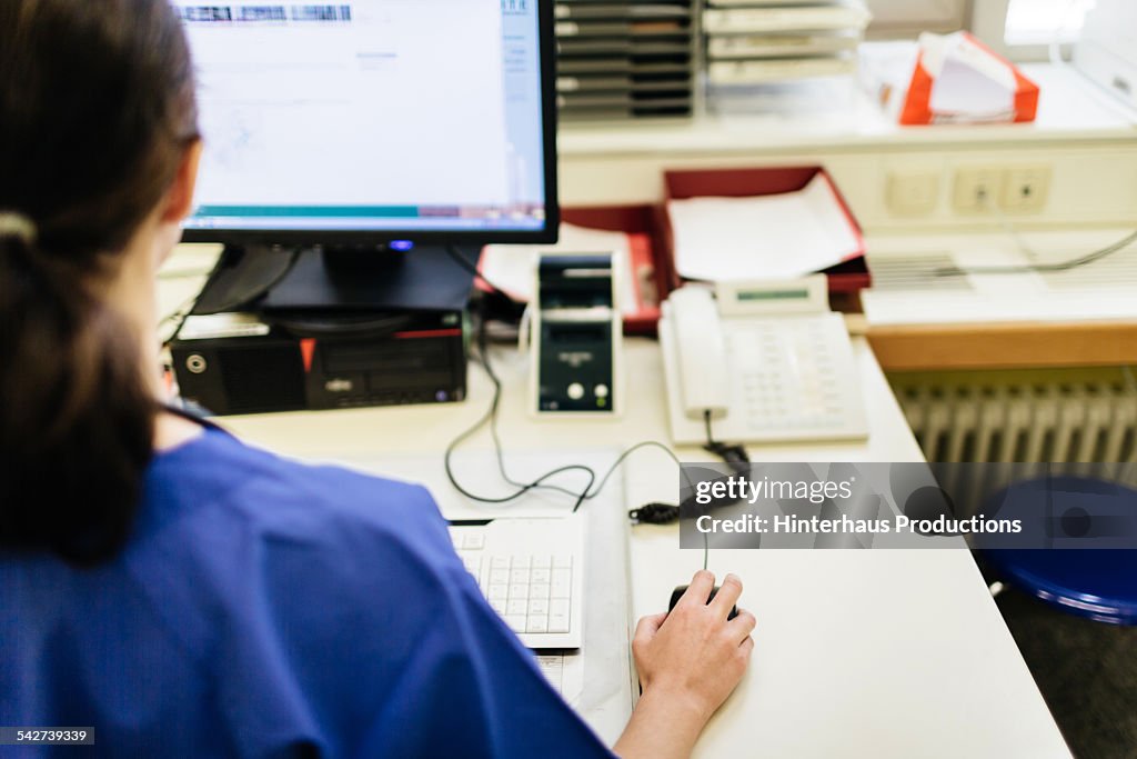 Doctor Working On Computer