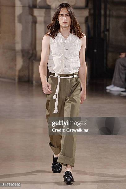 Model walks the runway at the Maison Margiela Spring Summer 2017 fashion show during Paris Menswear Fashion Week on June 24, 2016 in Paris, France.