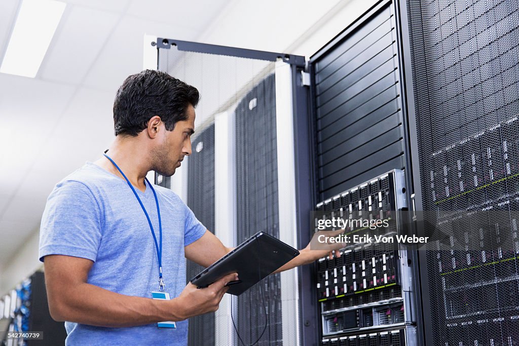 People working in modern server room