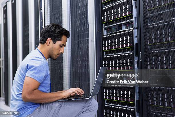 people working in modern server room - server di rete foto e immagini stock