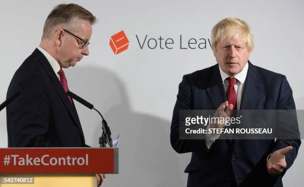 Former London Mayor and "Vote Leave" campaigner Boris Johnson , listens as British Lord Chancellor and Justice Secretary Michael Gove, a fellow...