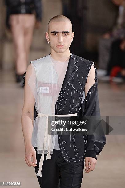 Model walks the runway at the Maison Margiela Spring Summer 2017 fashion show during Paris Menswear Fashion Week on June 24, 2016 in Paris, France.