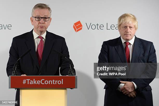 Michael Gove MP speaks during a press conference as Boris Johnson MP looks on following the results of the EU referendum at Westminster Tower on June...