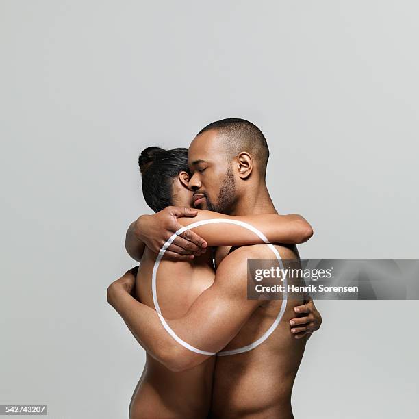 man and woman embracing each other - female body painting 個照片及圖片檔