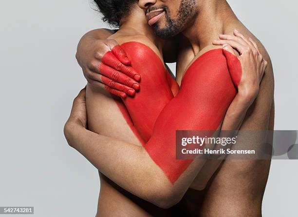 man and woman hugging - body paint stock pictures, royalty-free photos & images