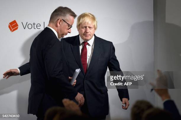 British Lord Chancellor and Justice Secretary Michael Gove walks by former London Mayor and "Vote Leave" campaigner Boris Johnson during a press...