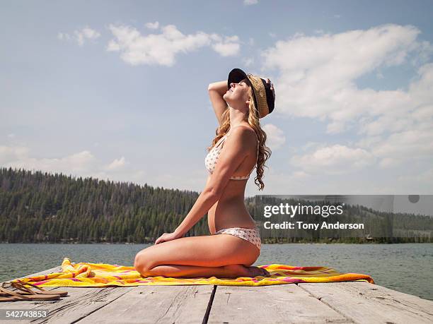 young woman on dock at mountain lake - spotted lake stock pictures, royalty-free photos & images