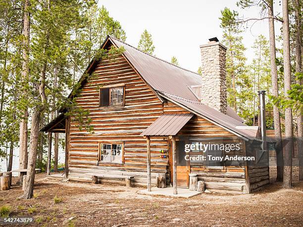 rustic cabin near mountain lake - log cabin stock pictures, royalty-free photos & images