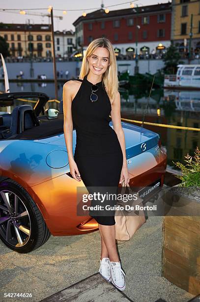 Miss Italia 2013 Giulia Arena poses at the presentation of the Garage Italia Customs Mazda MX-5 Levanto during the Mazda Beach Party In Milan on June...