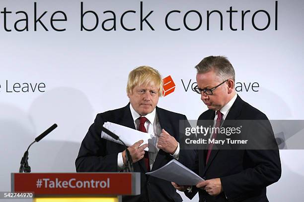 Justice Secretary Michael Gove prepares to speak following the results of the EU referendum as Conservative MP Boris Johnson listens at Westminster...