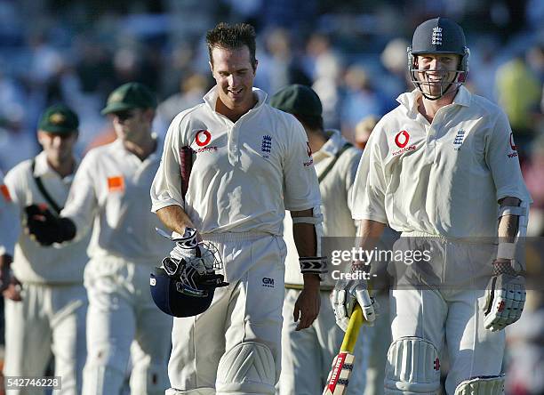 England batsmen Michael Vaughan and Richard Dawson , lead the Australian players off the ground at the end of day two of the third Ashes Test at the...